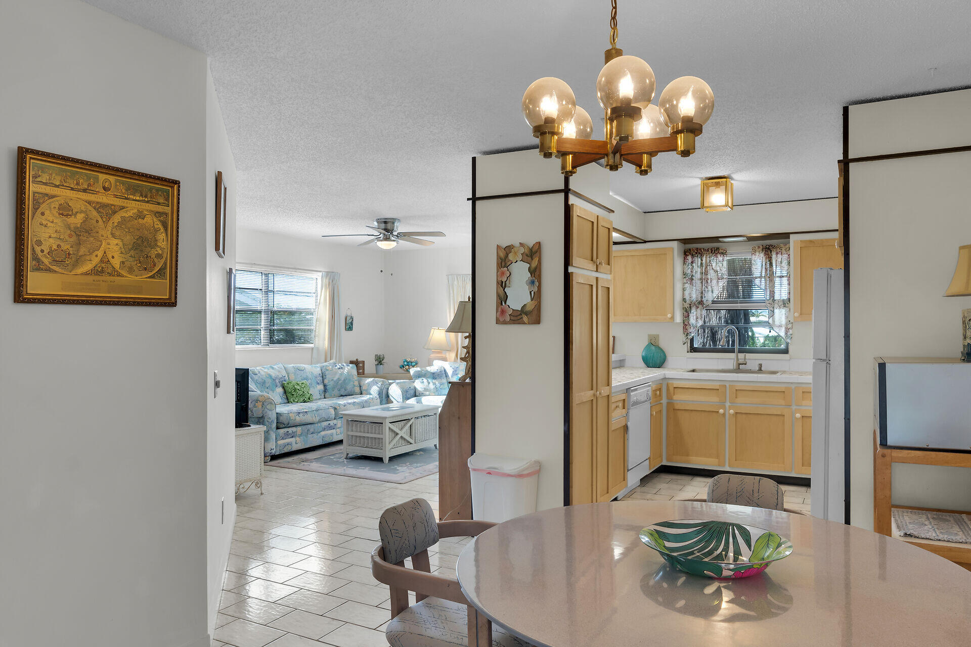 300 3rd Street Key Colony Beach, FL 33051 - Photo 20 of 51 a living room with fireplace furniture and a chandelier