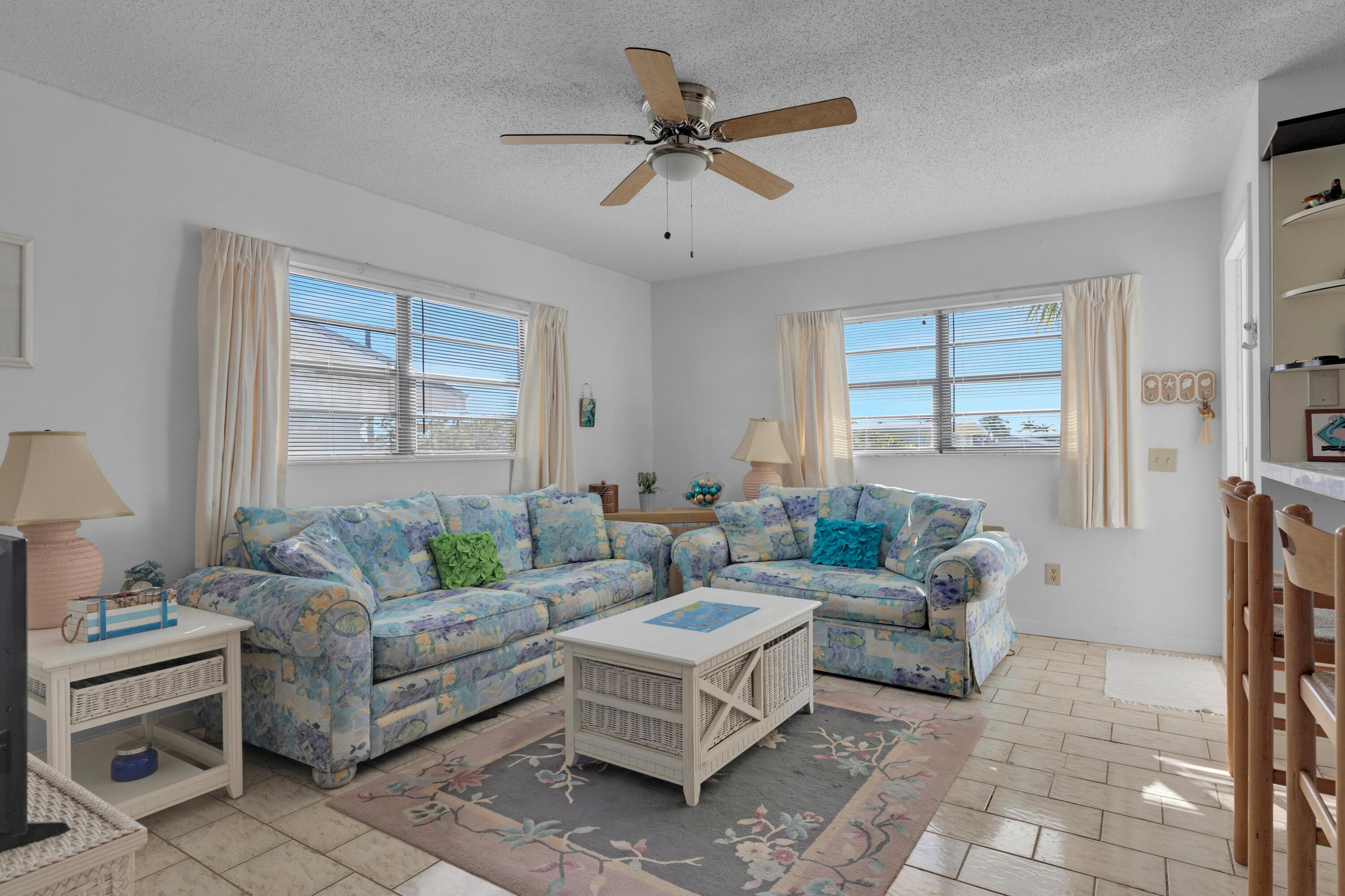 300 3rd Street Key Colony Beach, FL 33051 - Photo 2 of 51 a living room with furniture and a large window