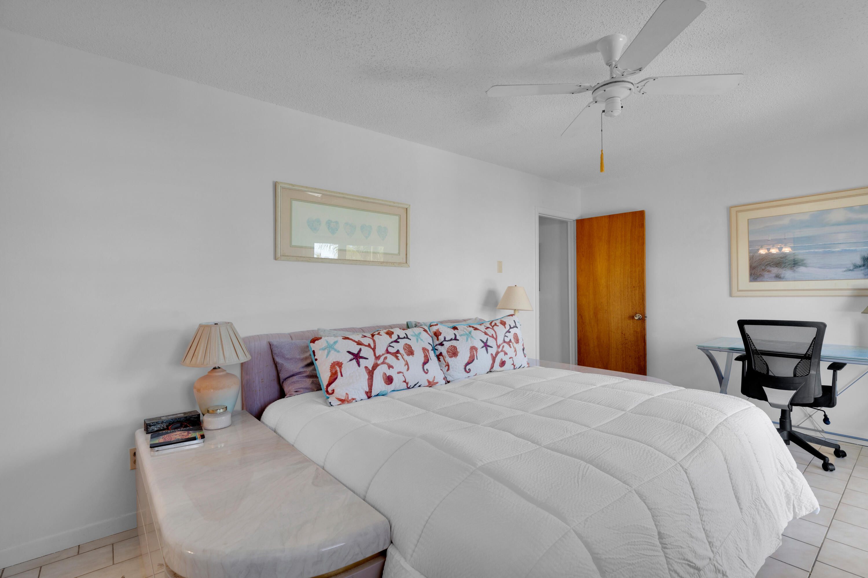 300 3rd Street Key Colony Beach, FL 33051 - Photo 21 of 51 a bedroom with a bed and a table in it