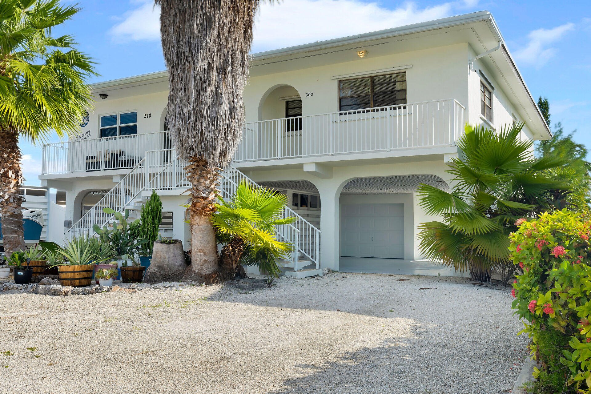 300 3rd Street Key Colony Beach, FL 33051 - Photo 25 of 51 a front view of a house with plants