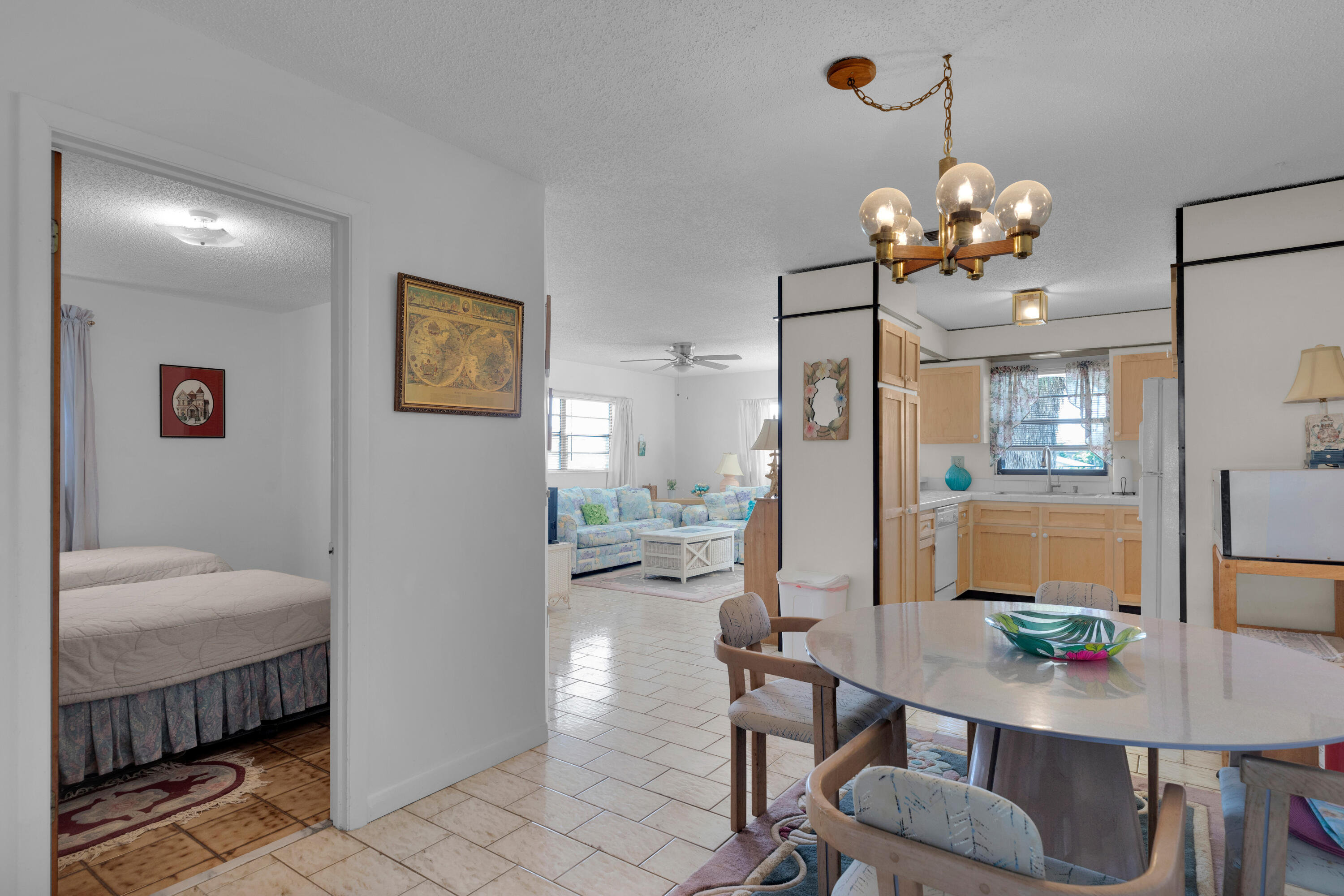 300 3rd Street Key Colony Beach, FL 33051 - Photo 5 of 51 a view of a dining room with furniture and chandelier