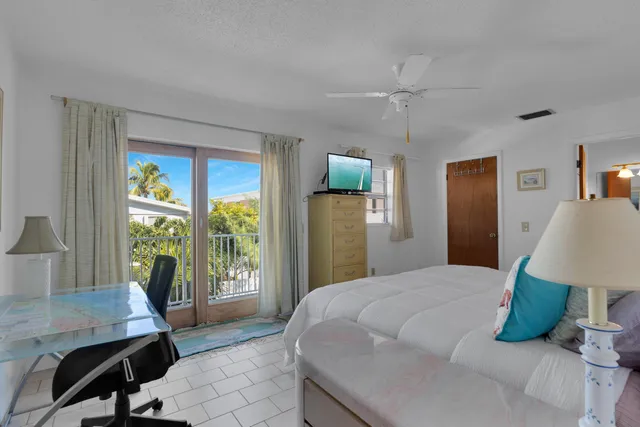 a bedroom with a bed and a table