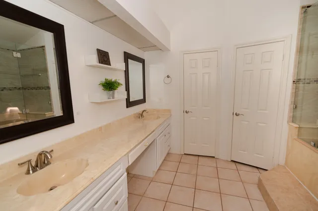 a bed sitting in a room next to a window