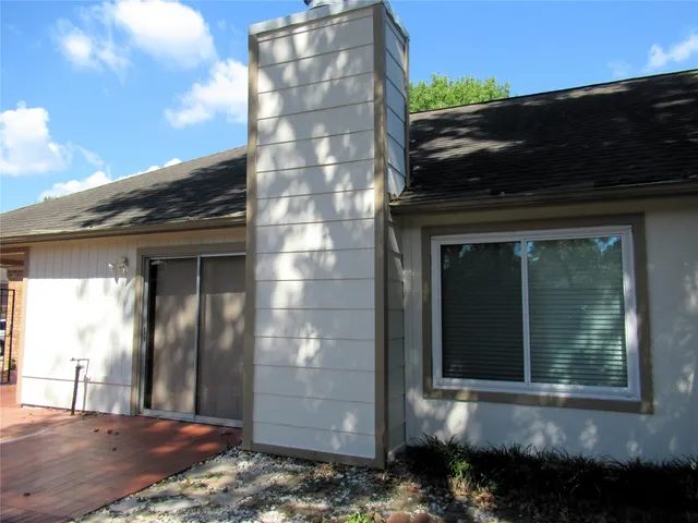 a bathroom with a sink a toilet and shower curtain