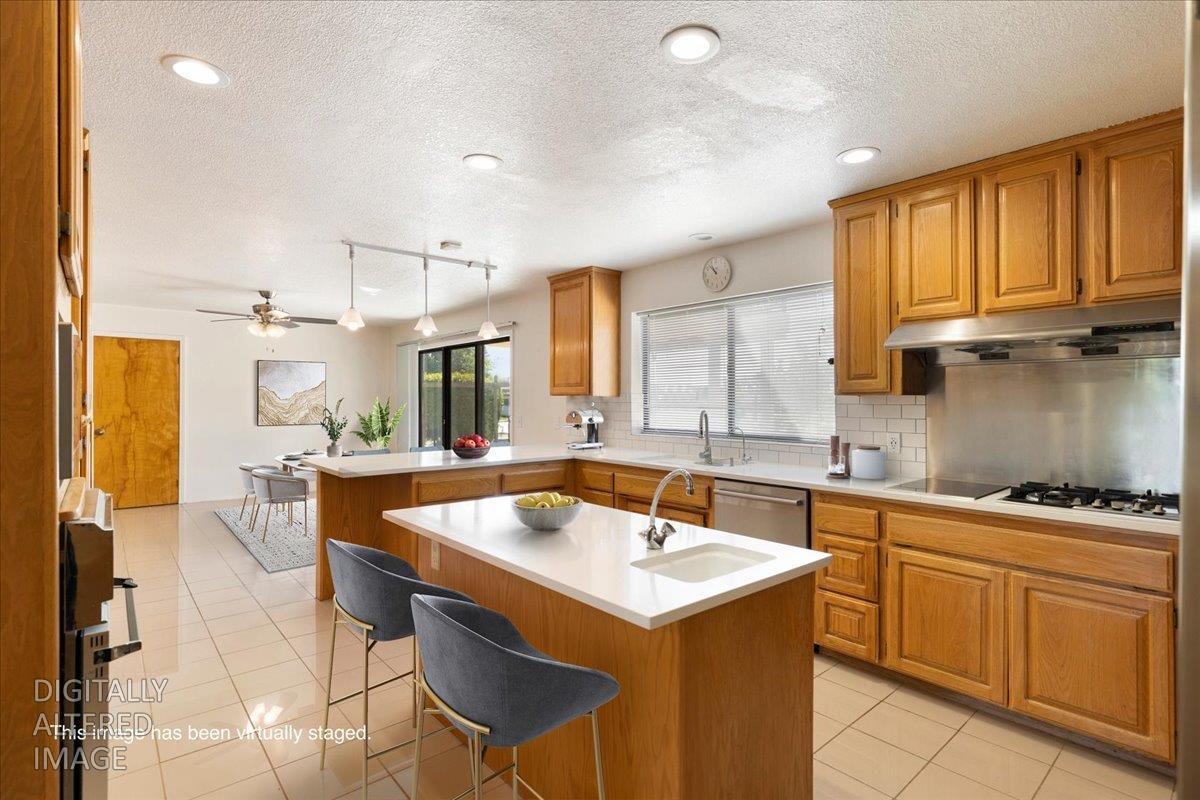 9930 Calvine Road Sacramento, CA 95829 - Photo 14 of 97 a kitchen with a sink and chairs