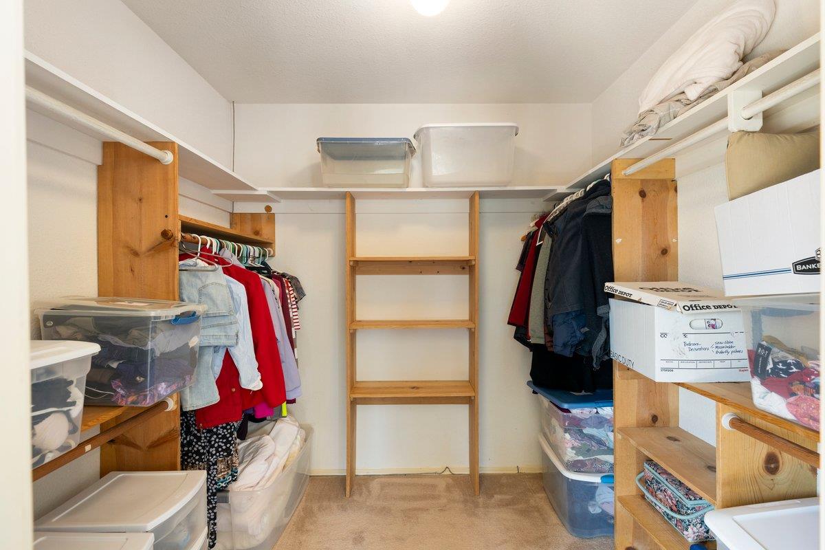 9930 Calvine Road Sacramento, CA 95829 - Photo 19 of 97 a view of walk in closet with clothes and shoes