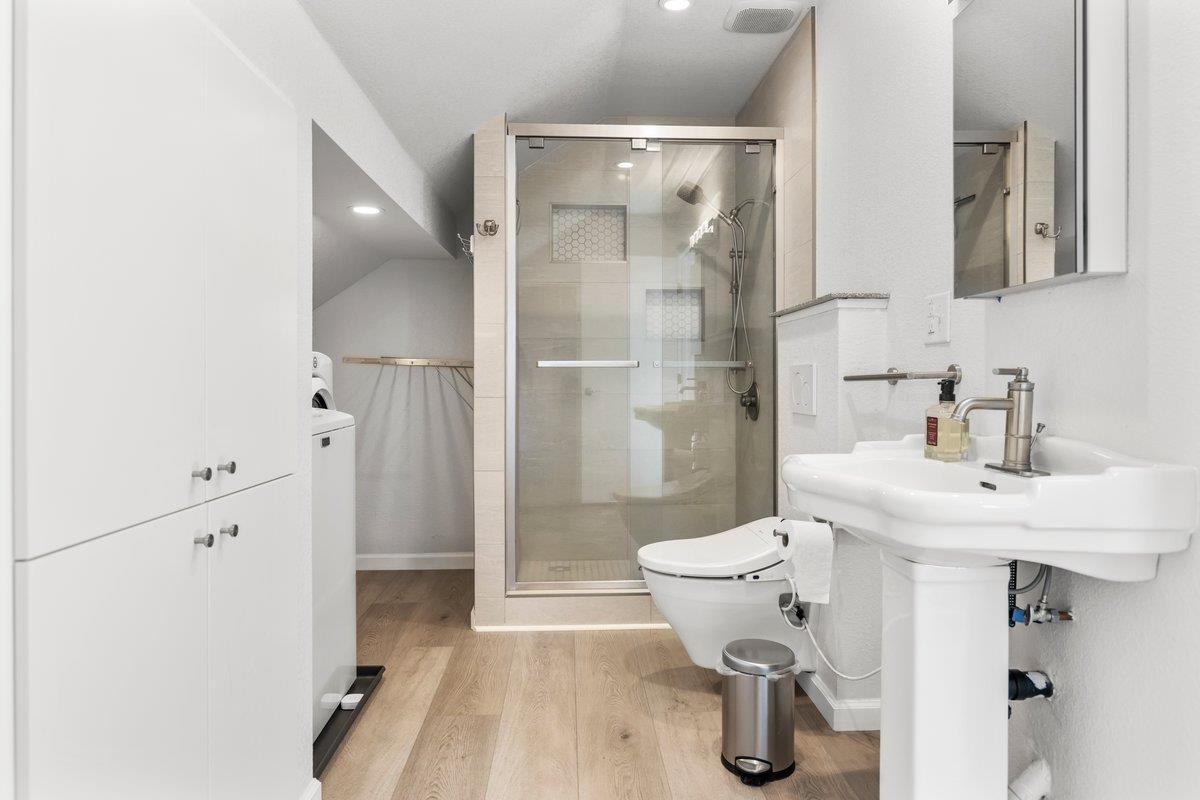 9930 Calvine Road Sacramento, CA 95829 - Photo 49 of 85 In-Law-Quarters 2 - Bathroom with inside laundry area, wall hung toilet, bidet, custom walk-in shower, built in speaker fan