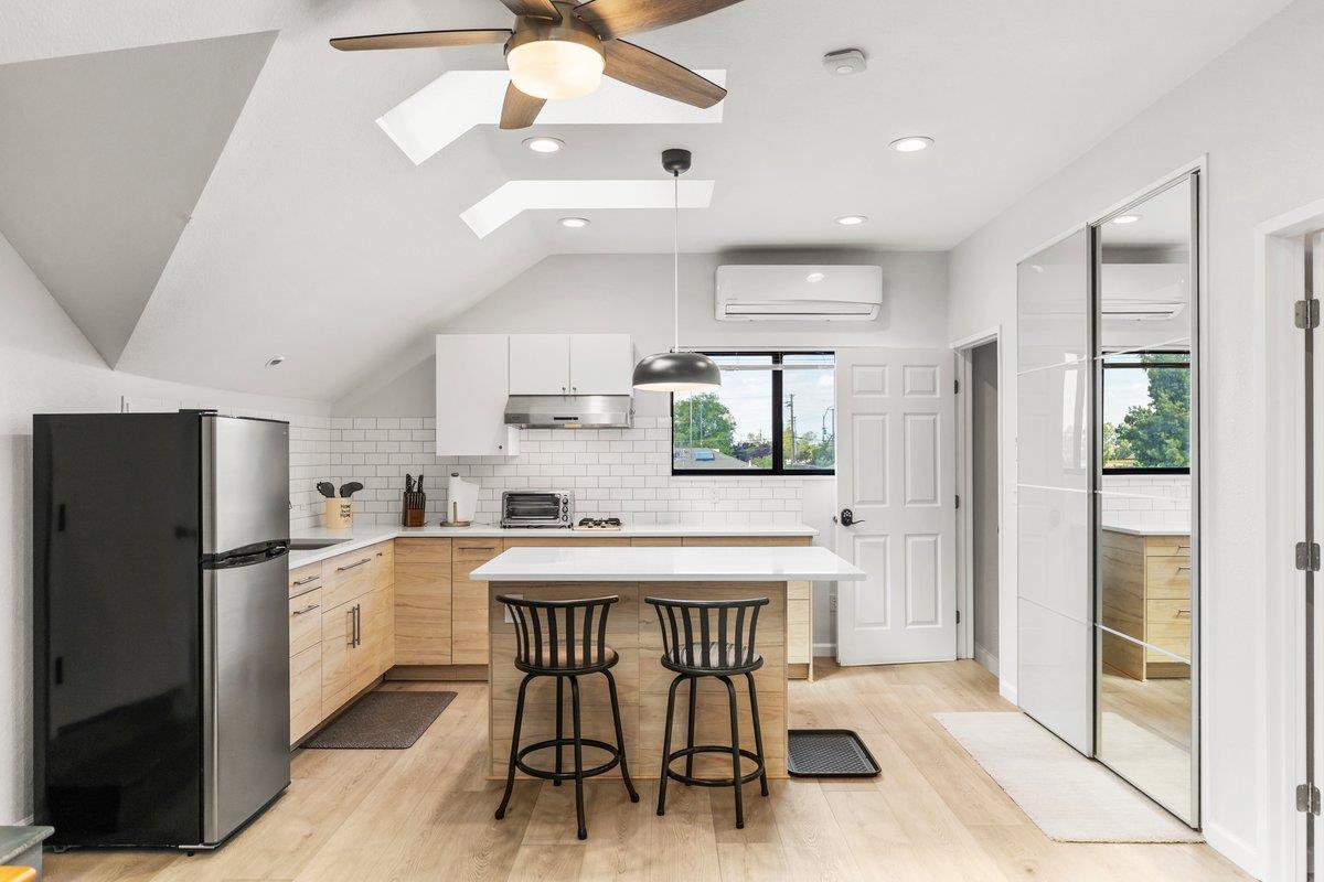 9930 Calvine Road Sacramento, CA 95829 - Photo 54 of 97 a kitchen with white cabinets and refrigerator