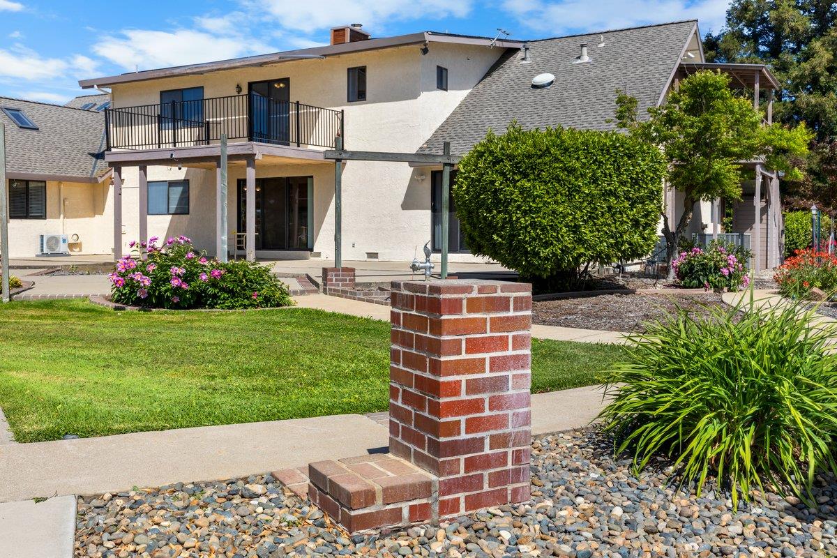 9930 Calvine Road Sacramento, CA 95829 - Photo 66 of 97 a front view of a house with a garden