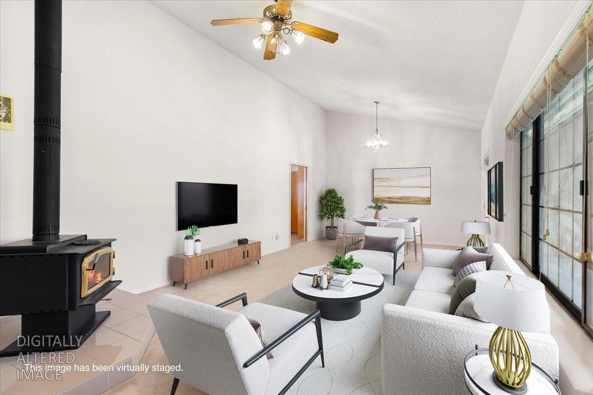 9930 Calvine Road Sacramento, CA 95829 - Photo 7 of 97 a living room with furniture and a flat screen tv