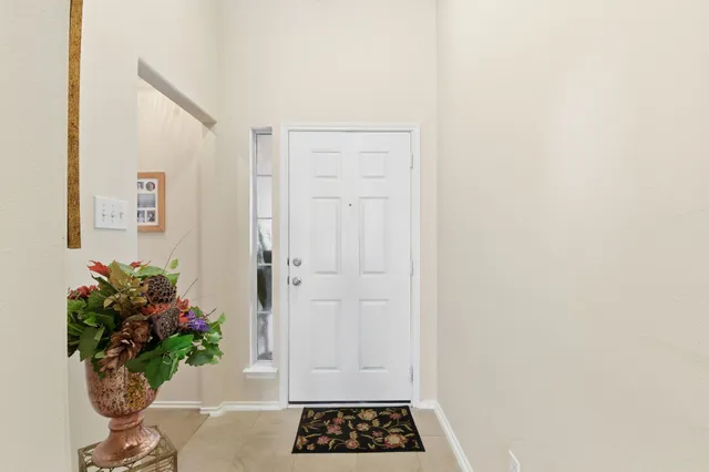 a bathroom with a double vanity sink mirror and shower