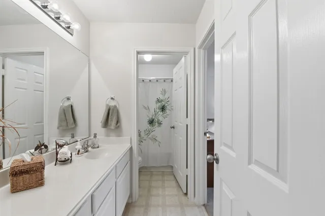 a bedroom with a bed and a table