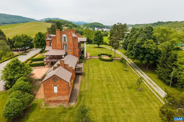 an aerial view of a house with a ocean view
