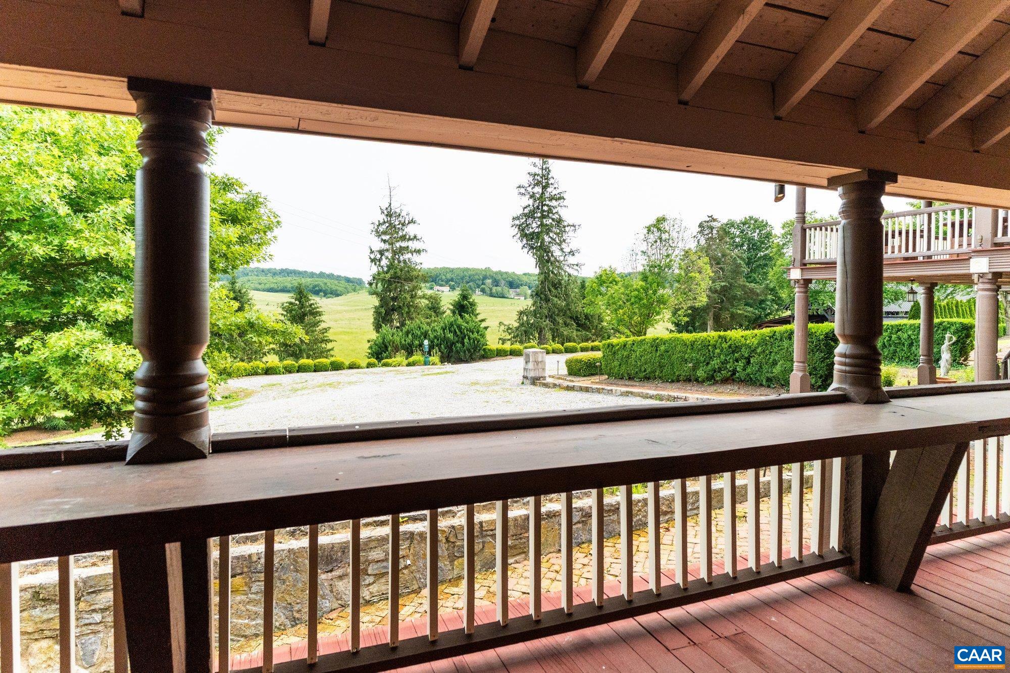 325 B Factory Outlet Drive Max Meadows, VA 24360 - Photo 53 of 66 a view of a porch with wooden floor in front of a yard