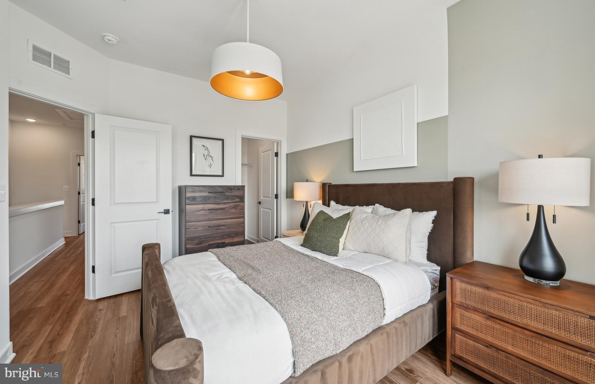505 Crossvine Lane Laurel, MD 20724 - Photo 19 of 54 a bedroom with a bed and a lamp on table