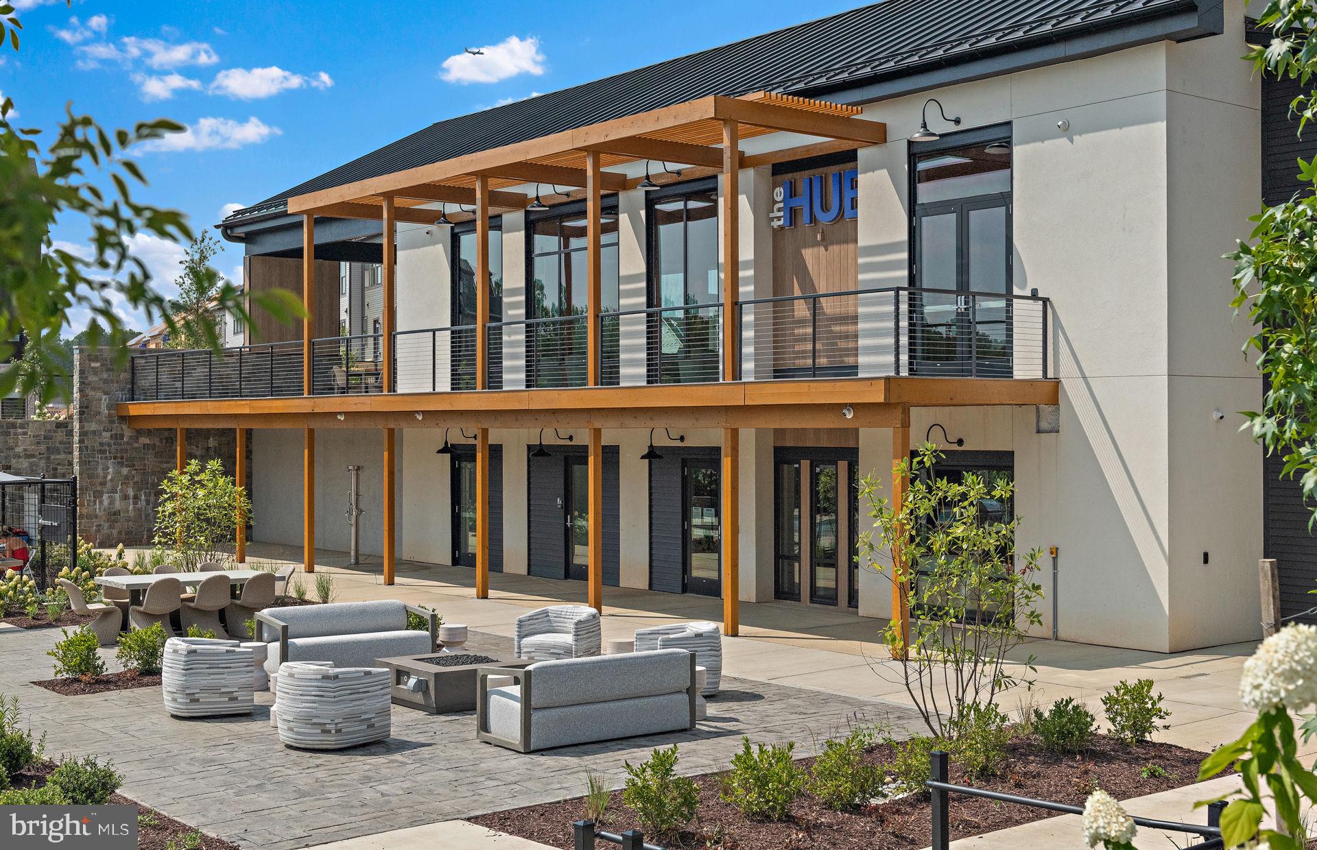 505 Crossvine Lane Laurel, MD 20724 - Photo 53 of 54 a front view of a house with outdoor seating and plants