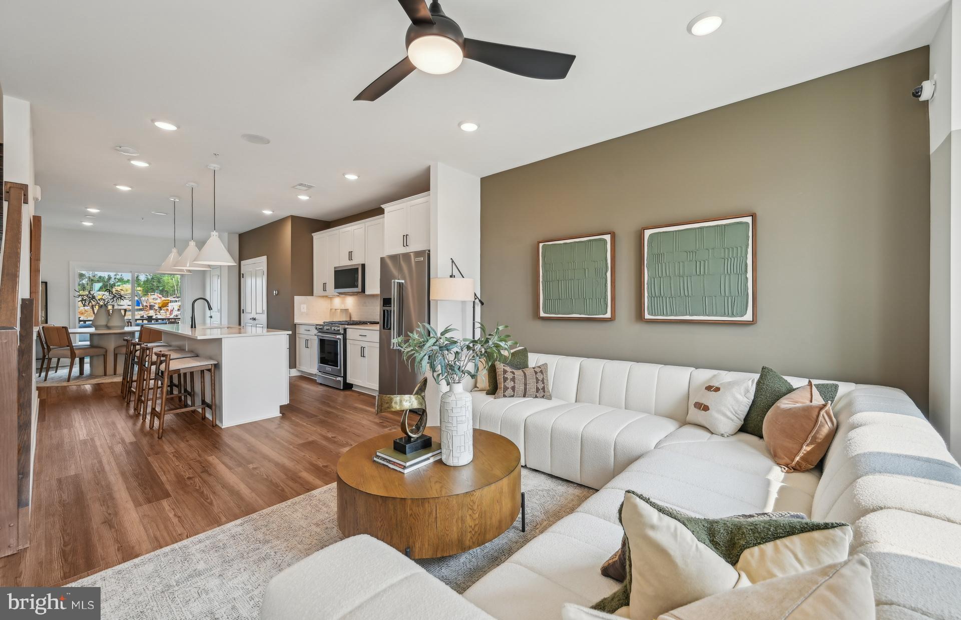 505 Crossvine Lane Laurel, MD 20724 - Photo 6 of 54 a living room with furniture kitchen view and a wooden floor