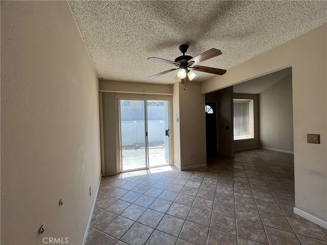 a view of an empty room with a bathroom
