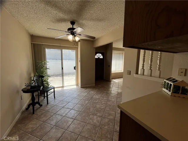 a view of a livingroom with furniture and an entryway