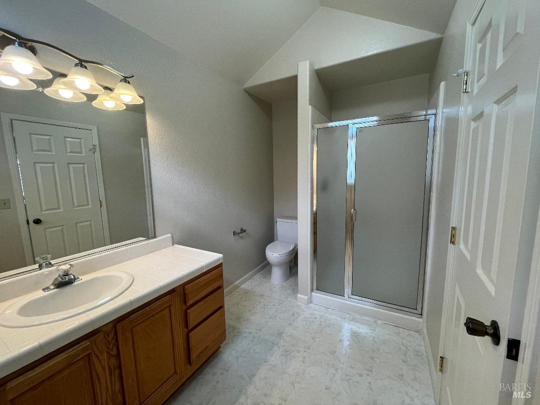 12 Monterey Court Novato, CA 94945 - Photo 12 of 15 a bathroom with a double vanity sink mirror and toilet