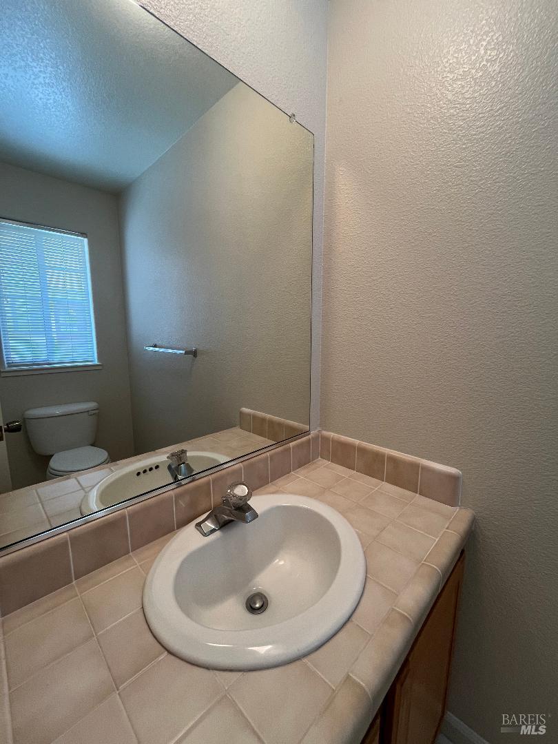 12 Monterey Court Novato, CA 94945 - Photo 15 of 15 a bathroom with a sink and a mirror