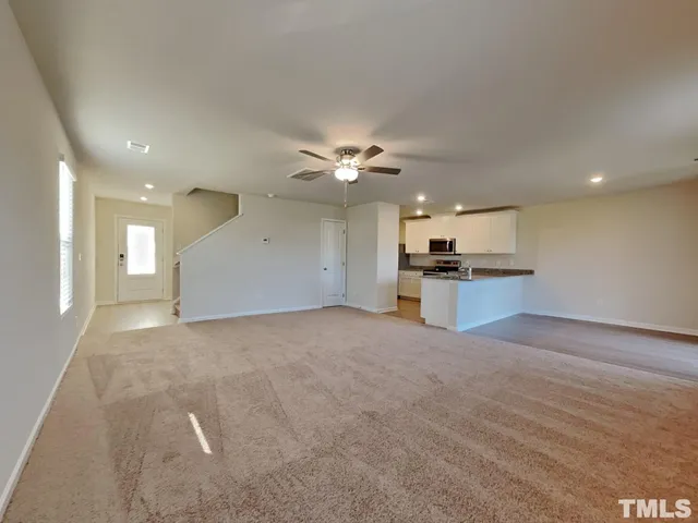 a view of a kitchen with a sink and cabinets