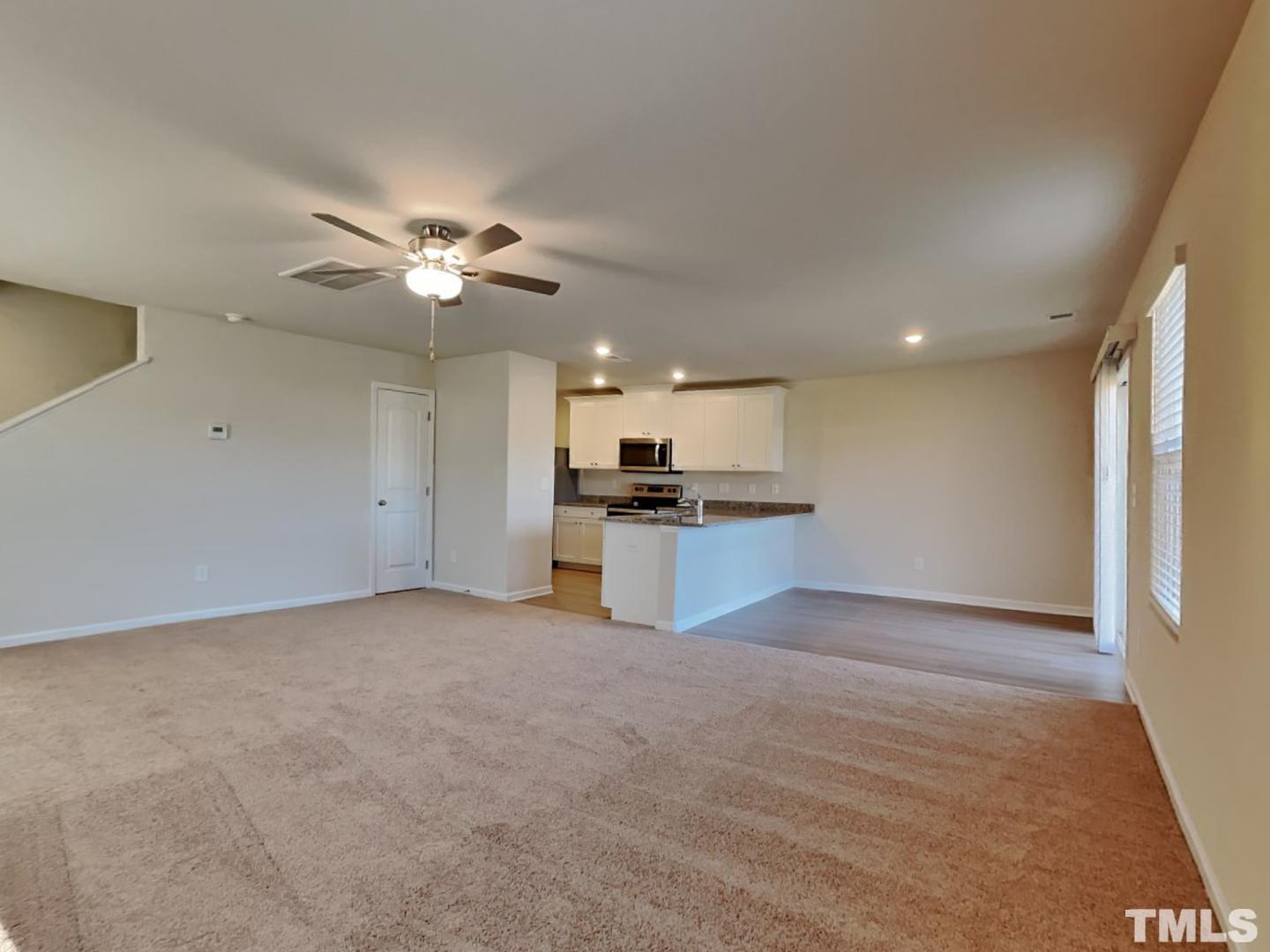 73 Barnsley Road Angier, NC 27501 - Photo 6 of 18 a view of kitchen with refrigerator and a sink