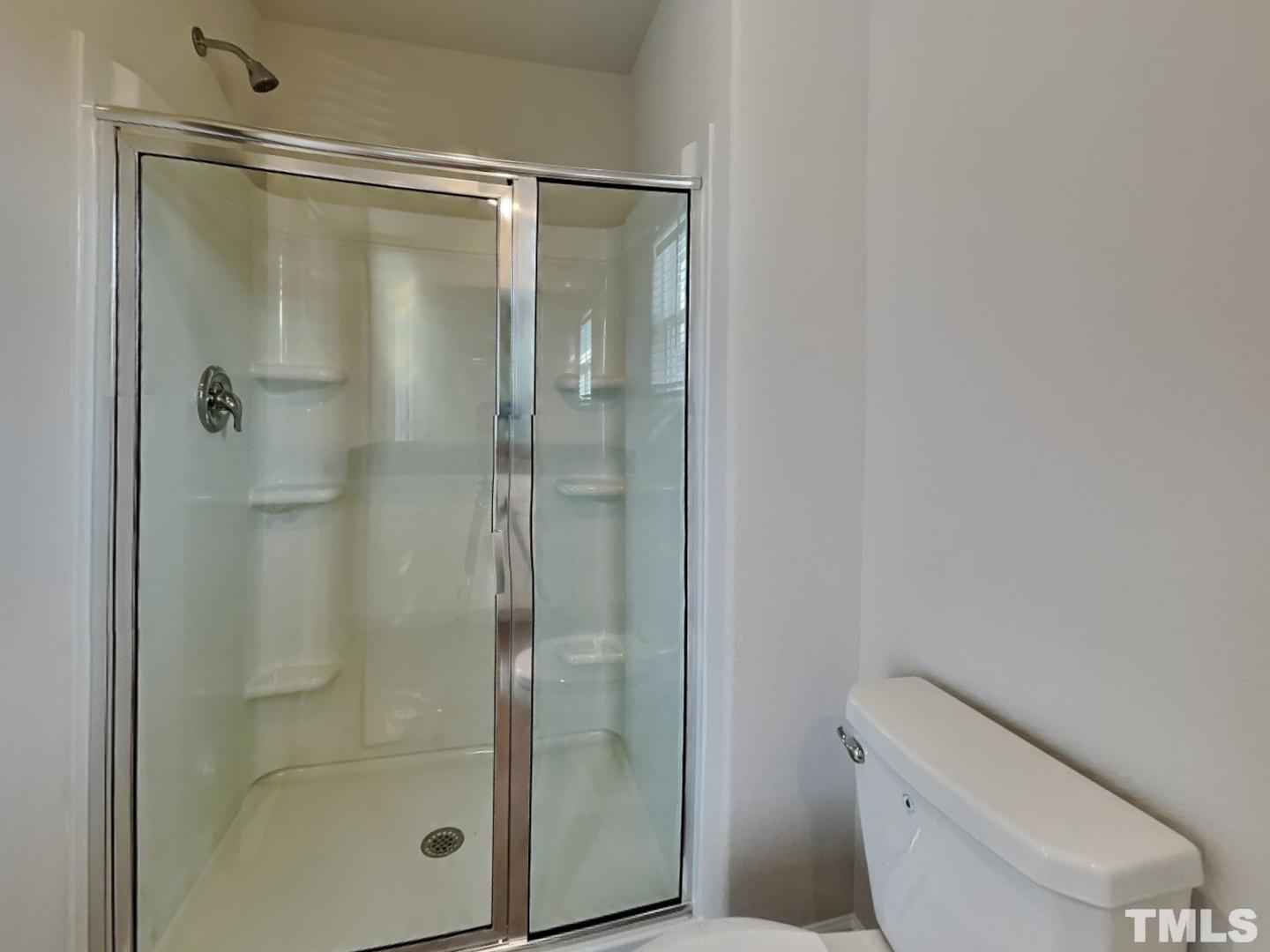 73 Barnsley Road Angier, NC 27501 - Photo 8 of 18 a bathroom with a shower a toilet and a sink