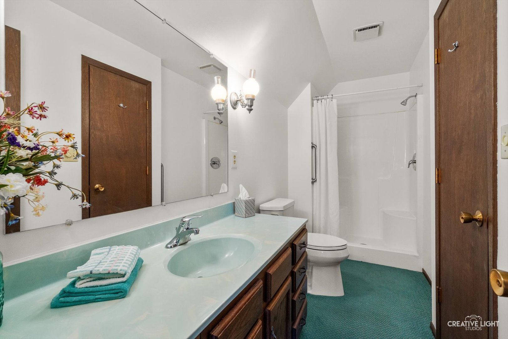 601 North View Street Hinckley, IL 60520 - Photo 14 of 18 a bathroom with a double vanity sink toilet and shower