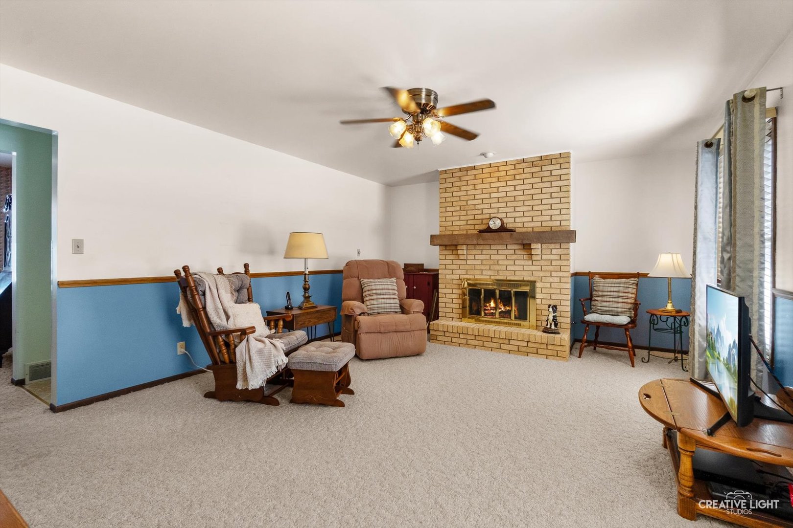 601 North View Street Hinckley, IL 60520 - Photo 4 of 18 a living room with furniture a fireplace and a flat screen tv