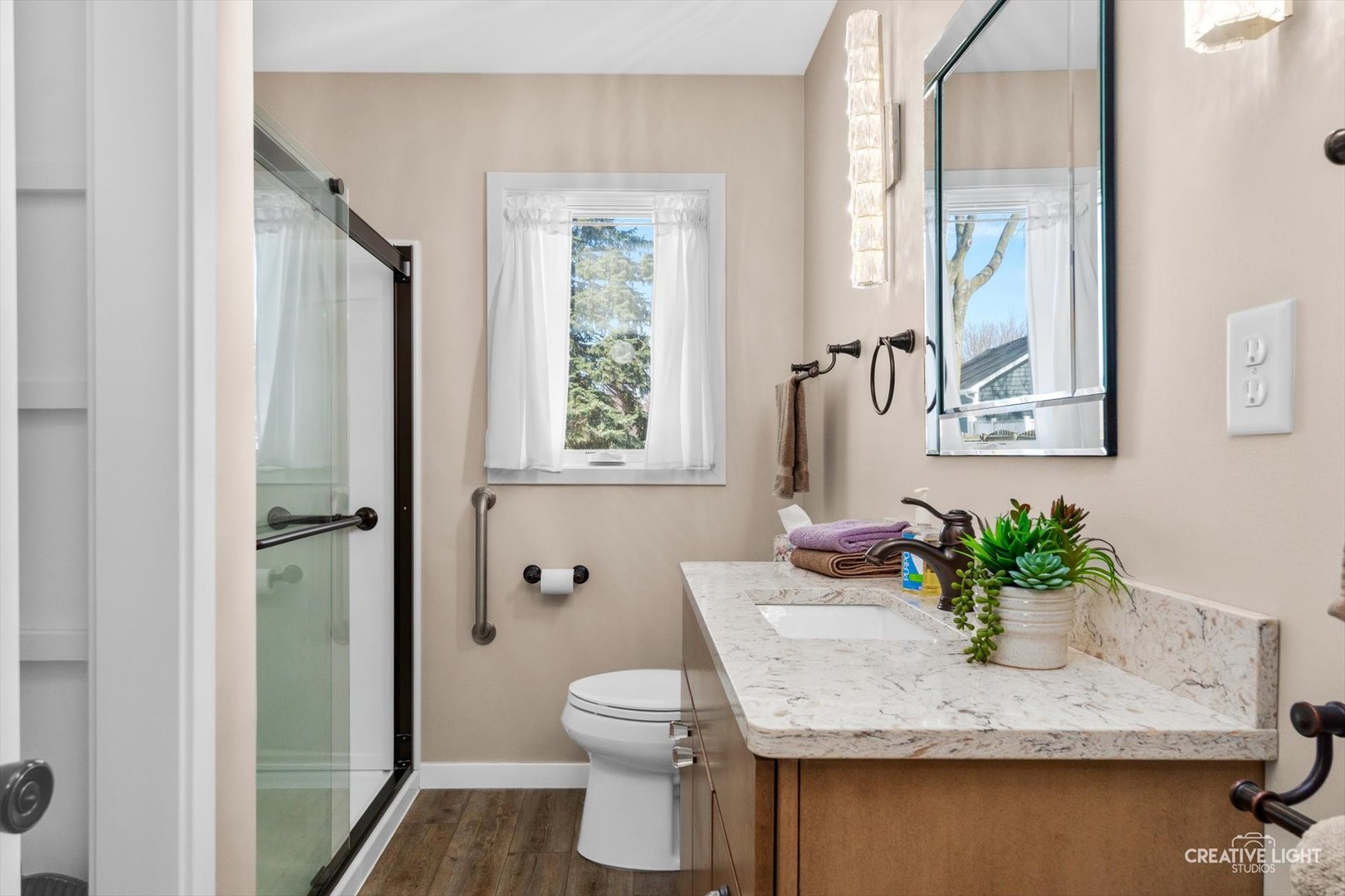 601 North View Street Hinckley, IL 60520 - Photo 7 of 18 a bathroom with a granite countertop sink a toilet and with mirror