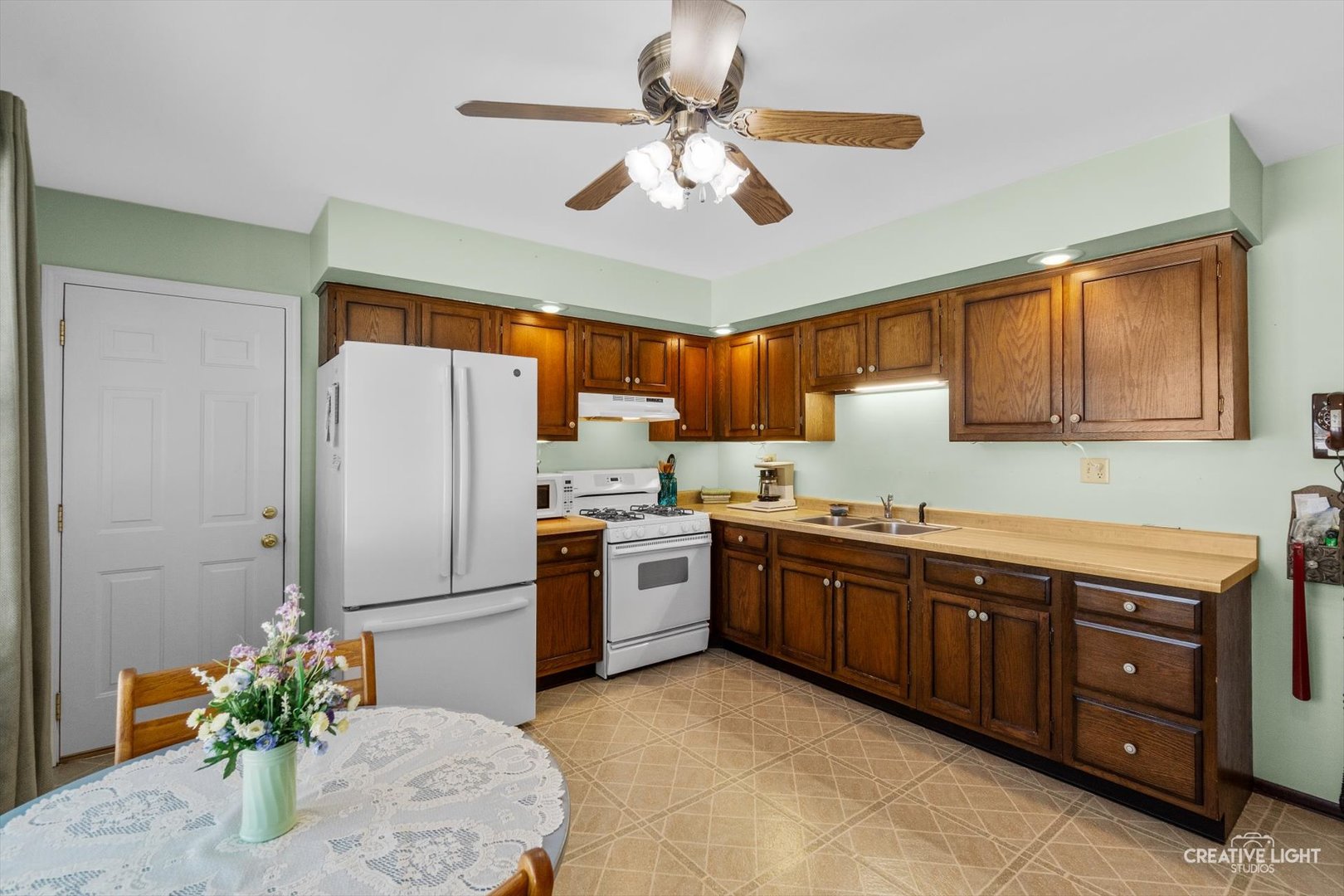 601 North View Street Hinckley, IL 60520 - Photo 8 of 18 a kitchen with stainless steel appliances granite countertop a stove refrigerator sink and cabinets