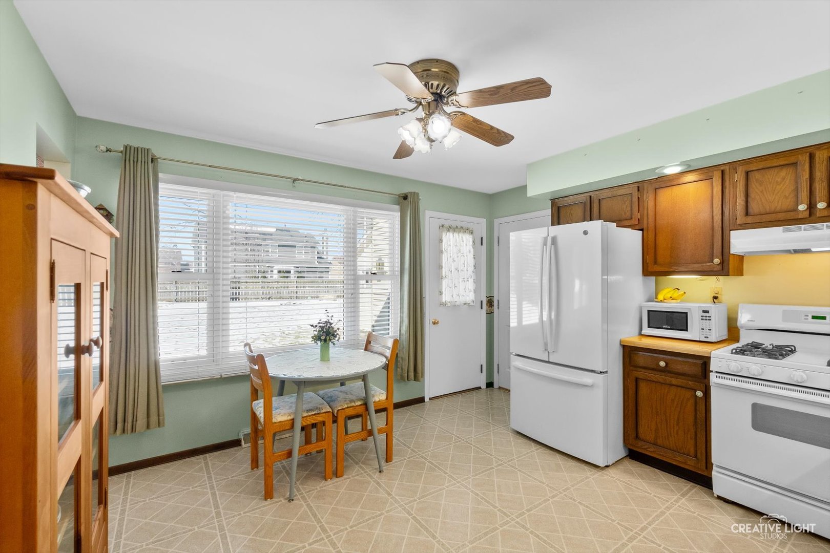 601 North View Street Hinckley, IL 60520 - Photo 9 of 18 a dining room with stainless steel appliances wooden floor and a refrigerator