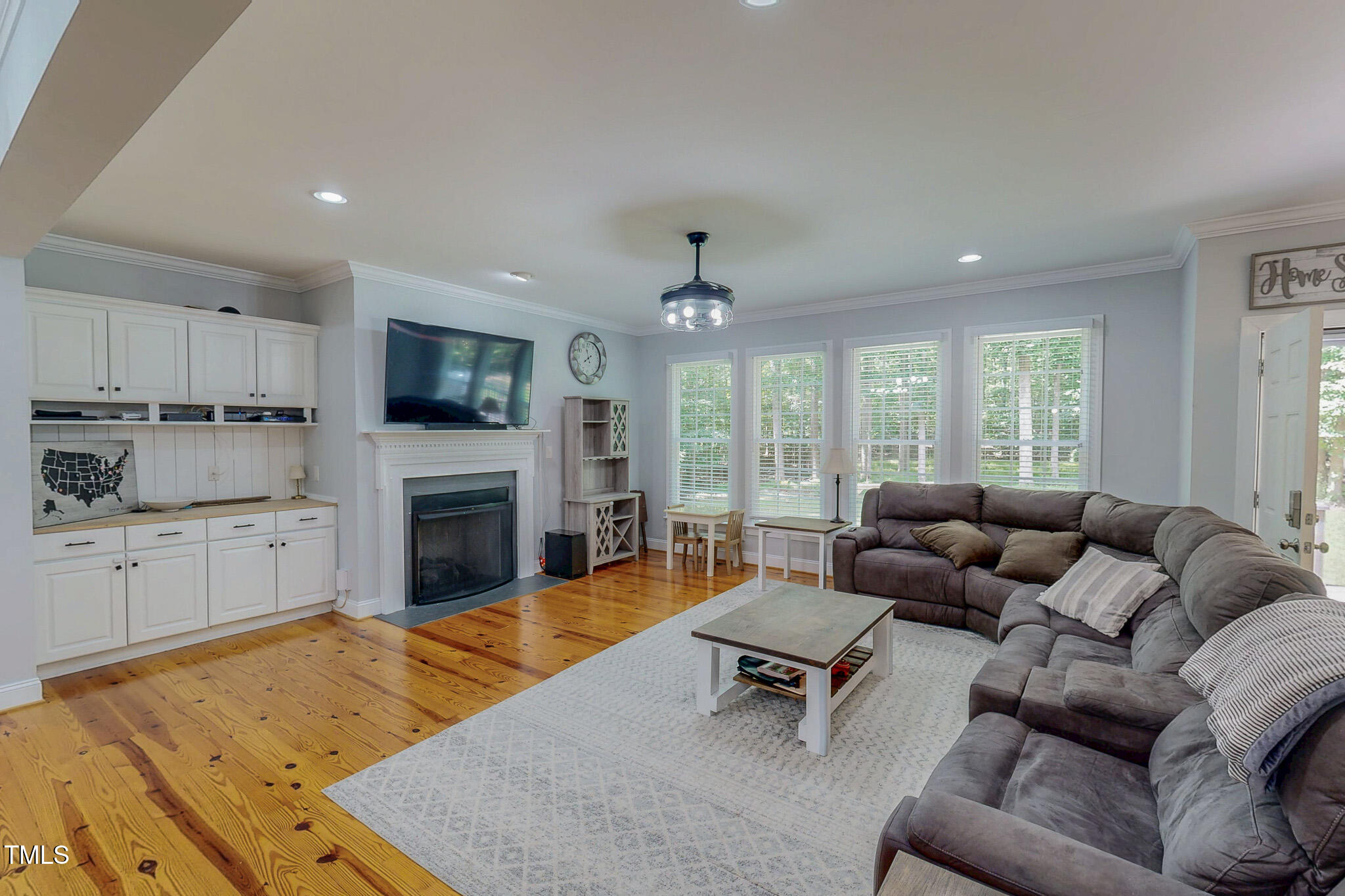 476 North Old Lantern Road Timberlake, NC 27583 - Photo 13 of 50 a living room with furniture fireplace and flat screen tv
