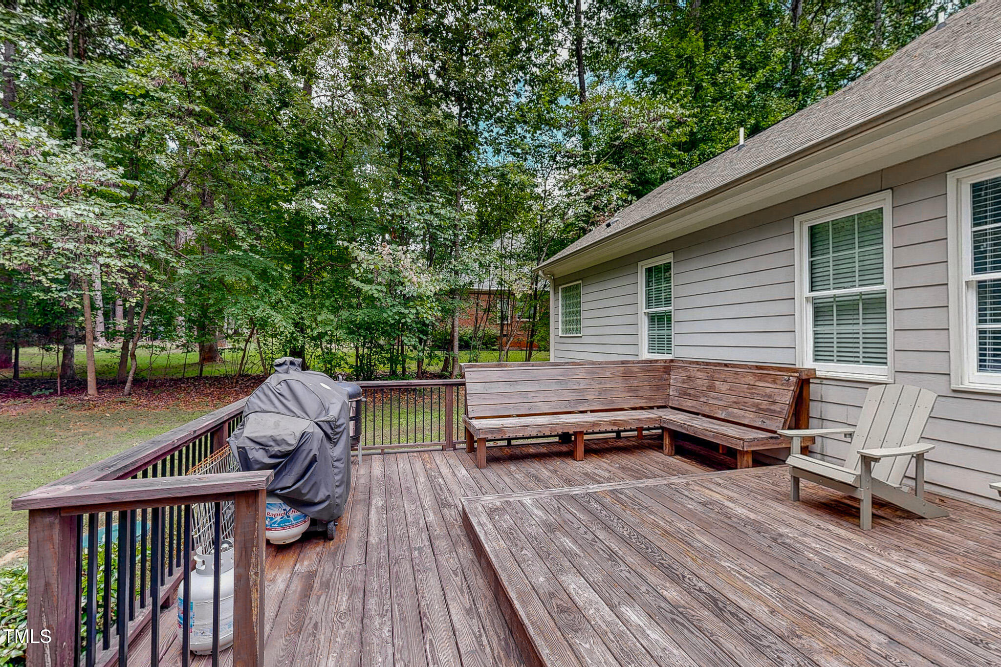476 North Old Lantern Road Timberlake, NC 27583 - Photo 17 of 50 a view of a roof deck with table and chairs and wooden floor