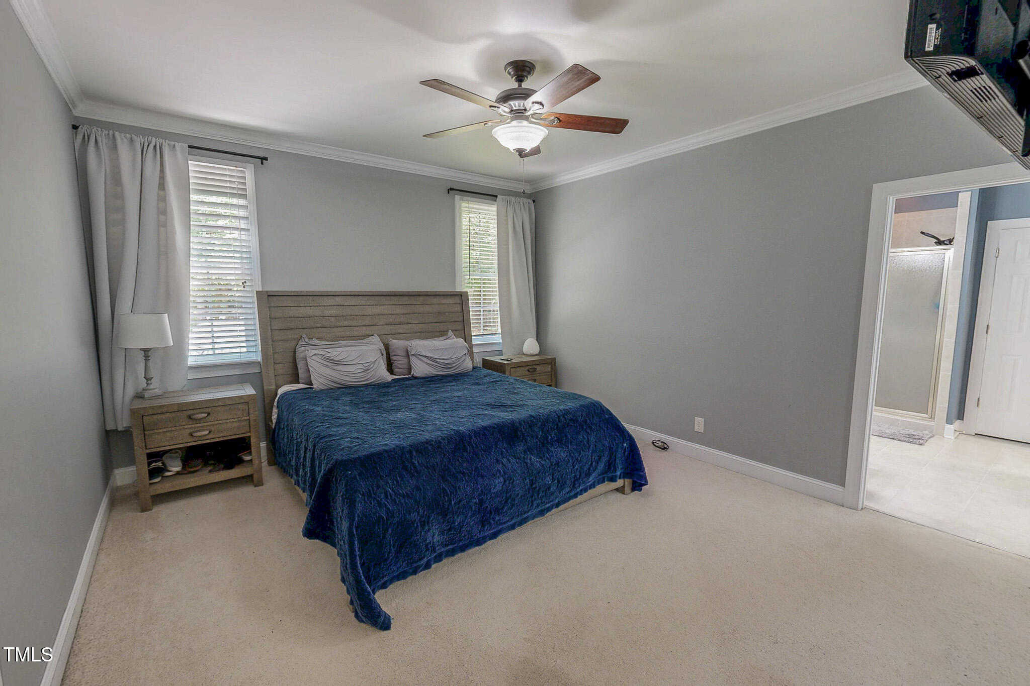 476 North Old Lantern Road Timberlake, NC 27583 - Photo 19 of 50 a bedroom with a large bed and a ceiling fan