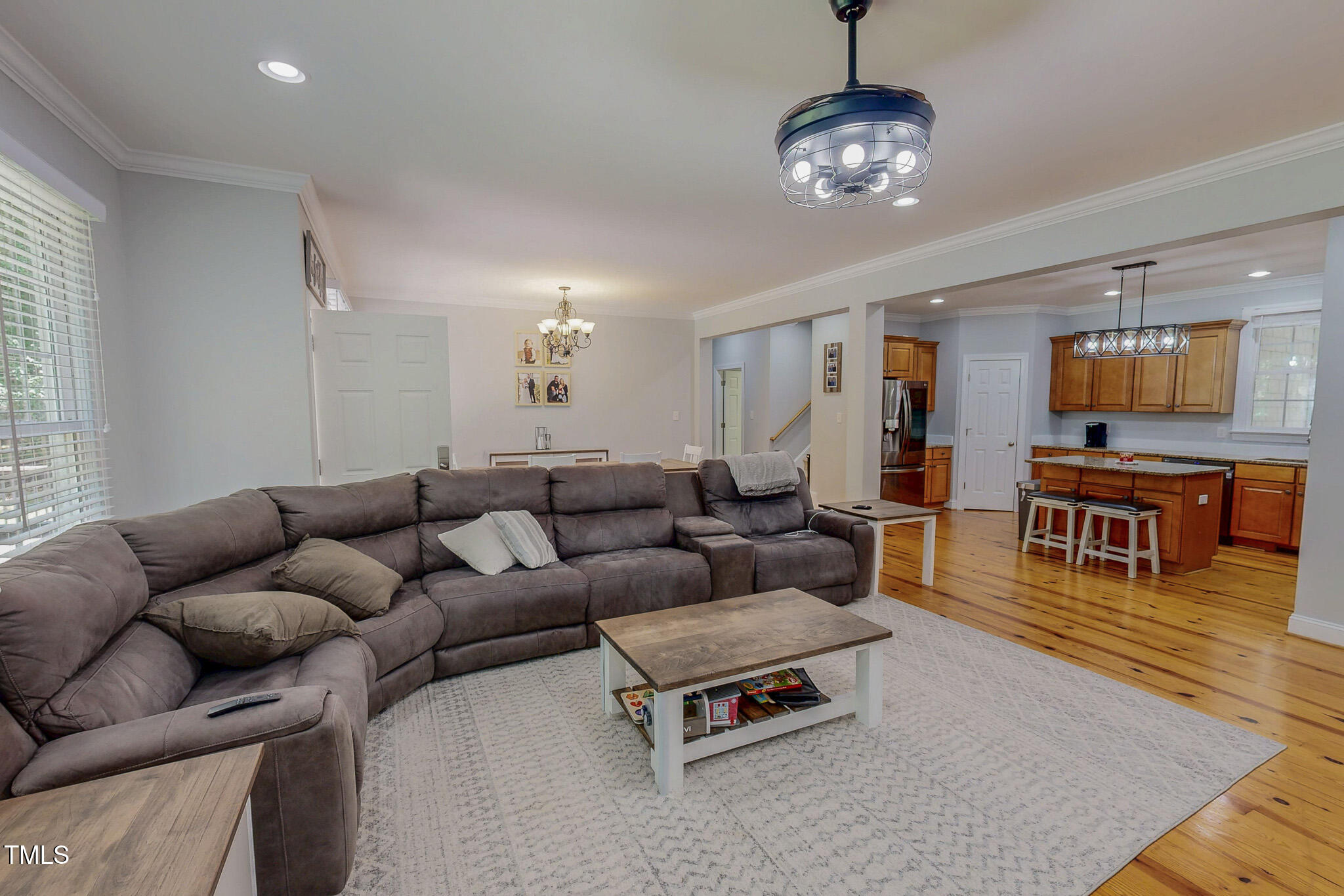 476 North Old Lantern Road Timberlake, NC 27583 - Photo 3 of 50 a living room with furniture a dining table and a chandelier
