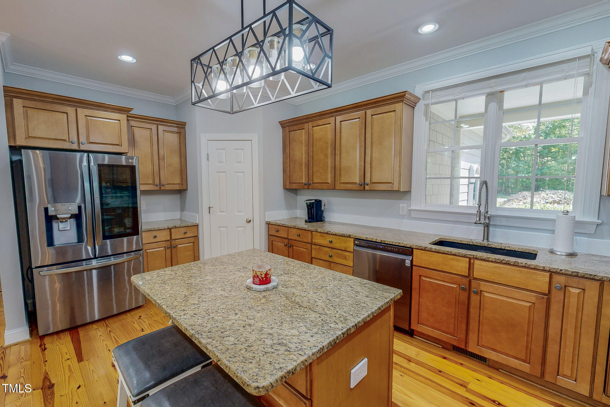 476 North Old Lantern Road Timberlake, NC 27583 - Photo 4 of 50 a kitchen with stainless steel appliances granite countertop a sink refrigerator and microwave