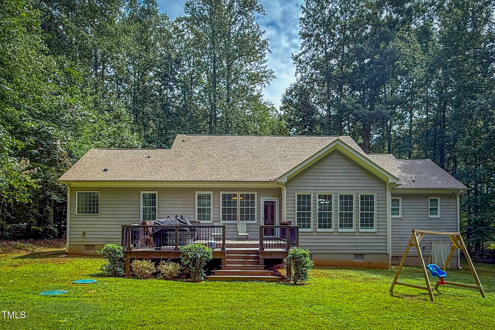 476 North Old Lantern Road Timberlake, NC 27583 - Photo 5 of 50 a front view of a house with a yard table and chairs