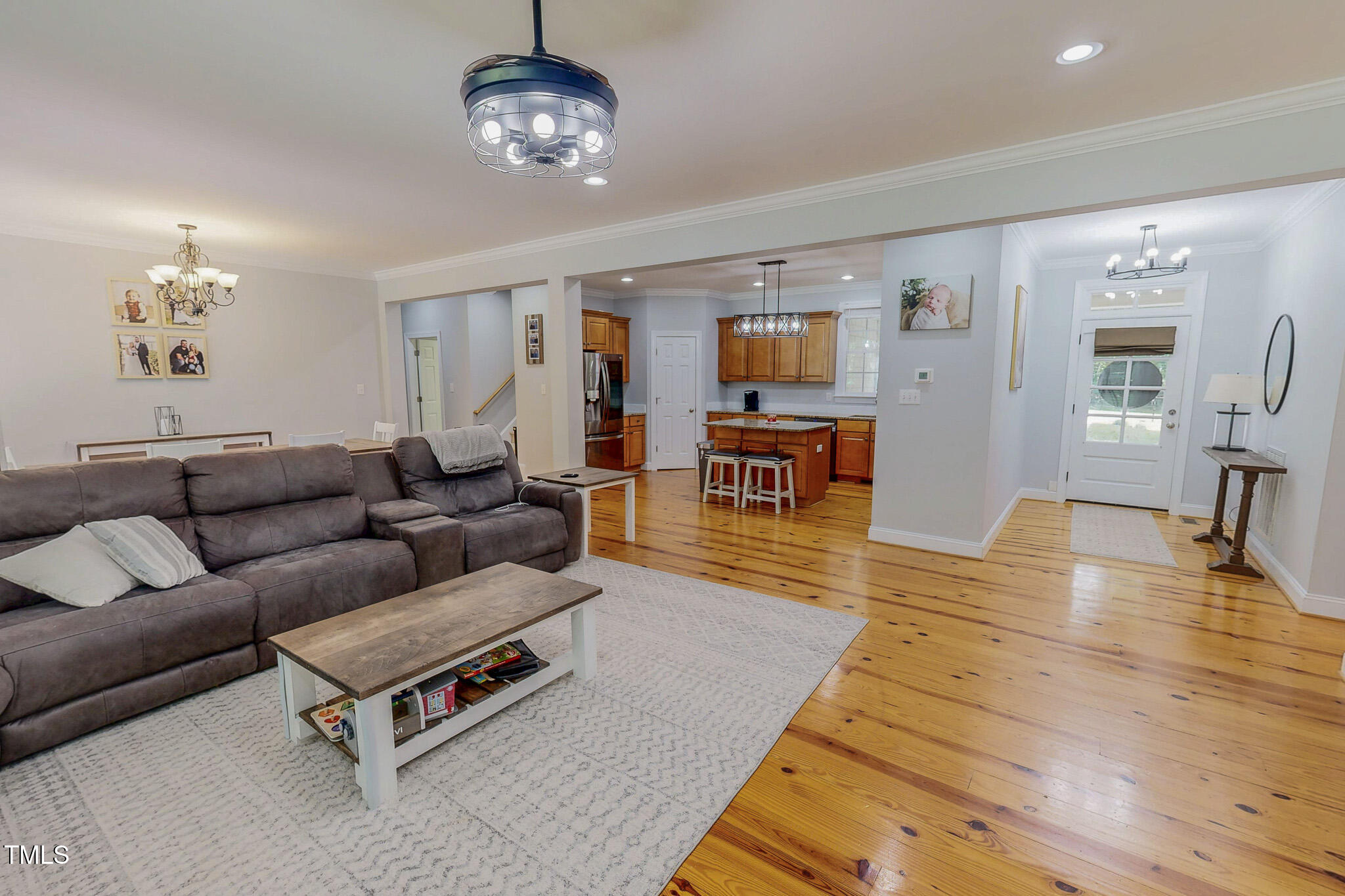 476 North Old Lantern Road Timberlake, NC 27583 - Photo 7 of 50 a living room with furniture a dining table and wooden floor