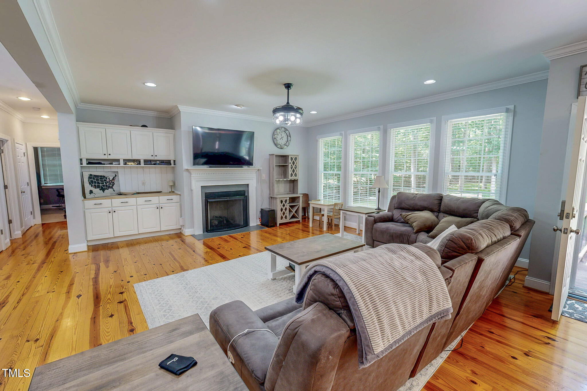476 North Old Lantern Road Timberlake, NC 27583 - Photo 9 of 50 a living room with furniture fireplace and flat screen tv