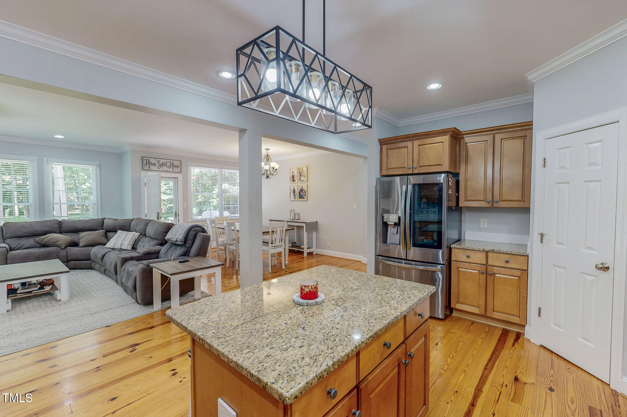 476 North Old Lantern Road Timberlake, NC 27583 - Photo 10 of 50 a kitchen with stainless steel appliances granite countertop sink stove refrigerator dining table and chairs