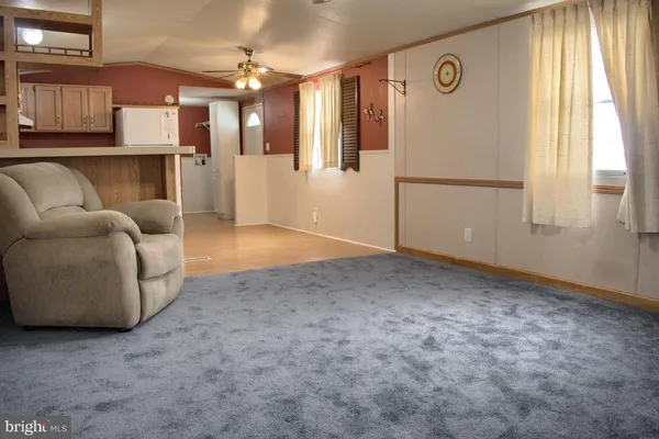 a view of livingroom with furniture and windows