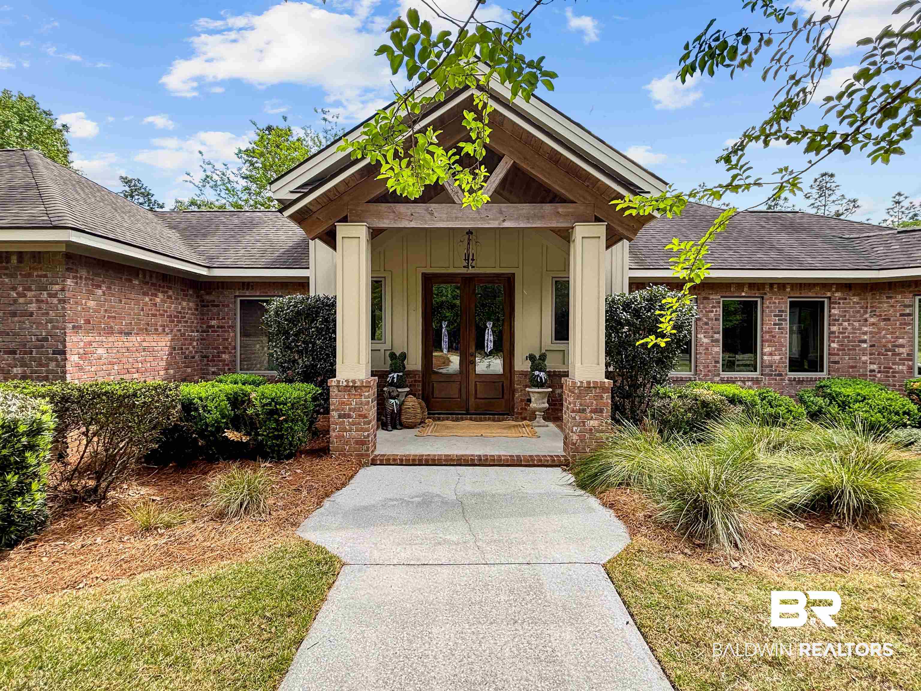 47252 Emmons Road Bay Minette, AL 36507 - Photo 5 of 50 View of exterior entry with a porch, french doors, brick siding, and roof with shingles