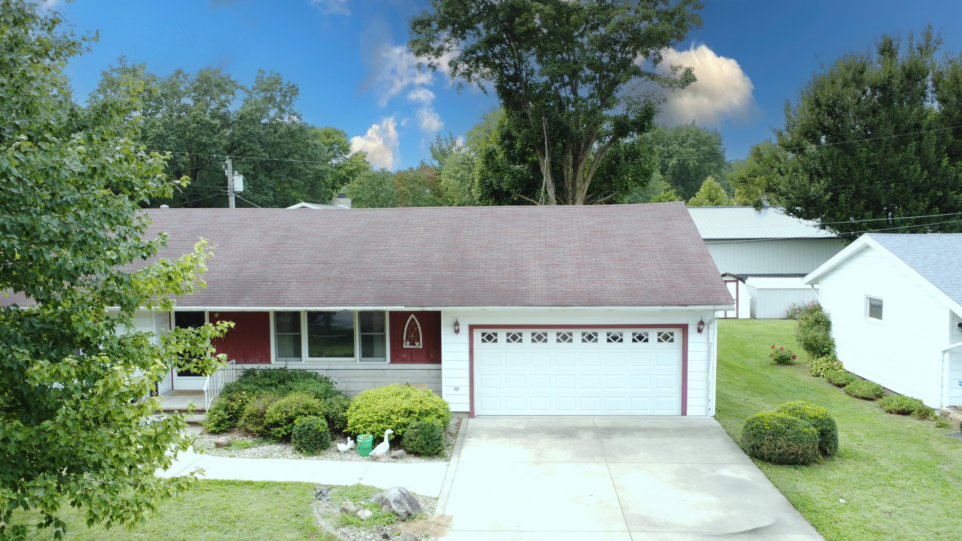 905 South 4th Street Watseka, IL 60970 - Photo 2 of 29 a view of a house with a yard and potted plants