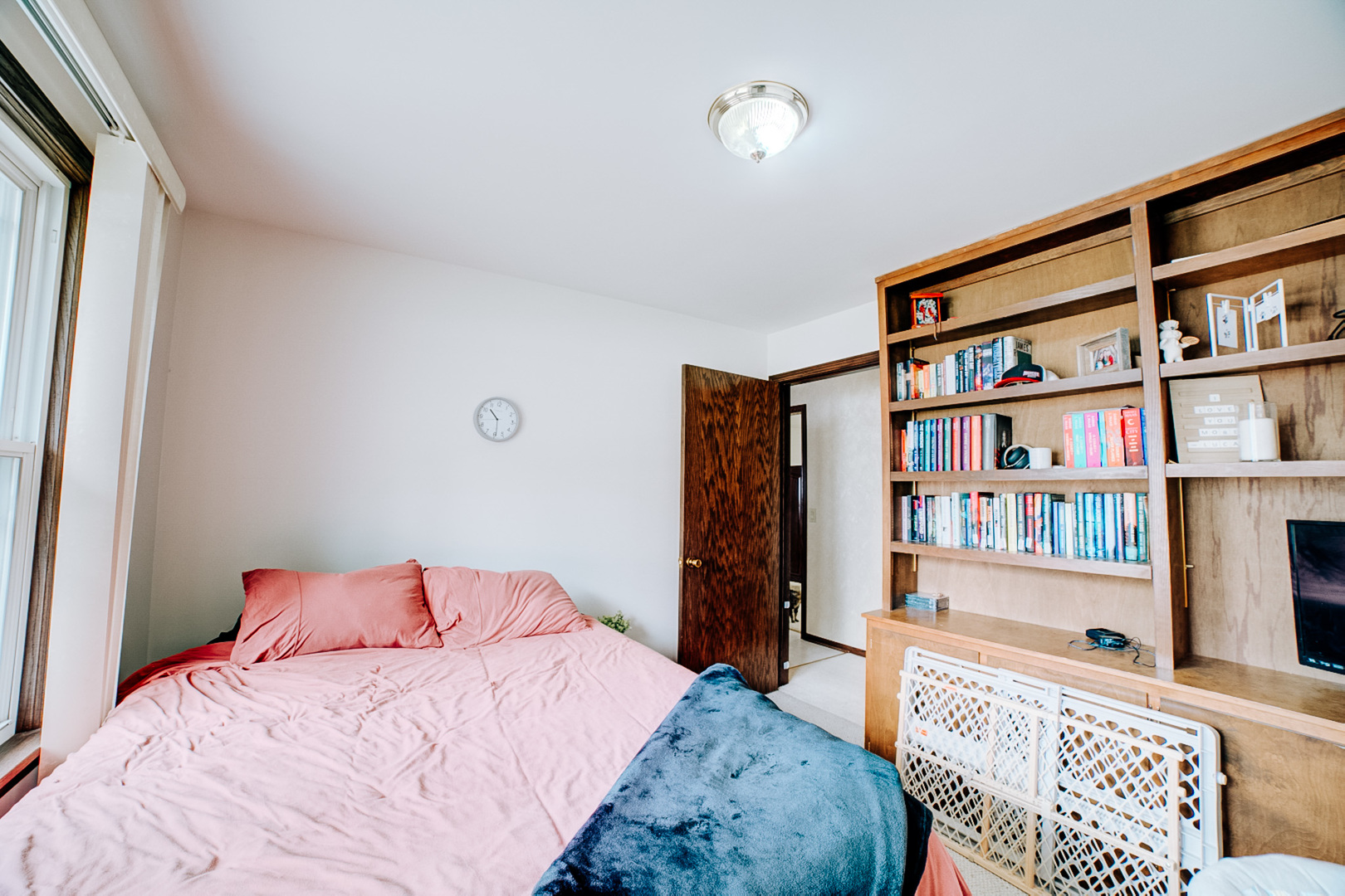 905 South 4th Street Watseka, IL 60970 - Photo 26 of 29 a bedroom with a bed furniture and a book shelf