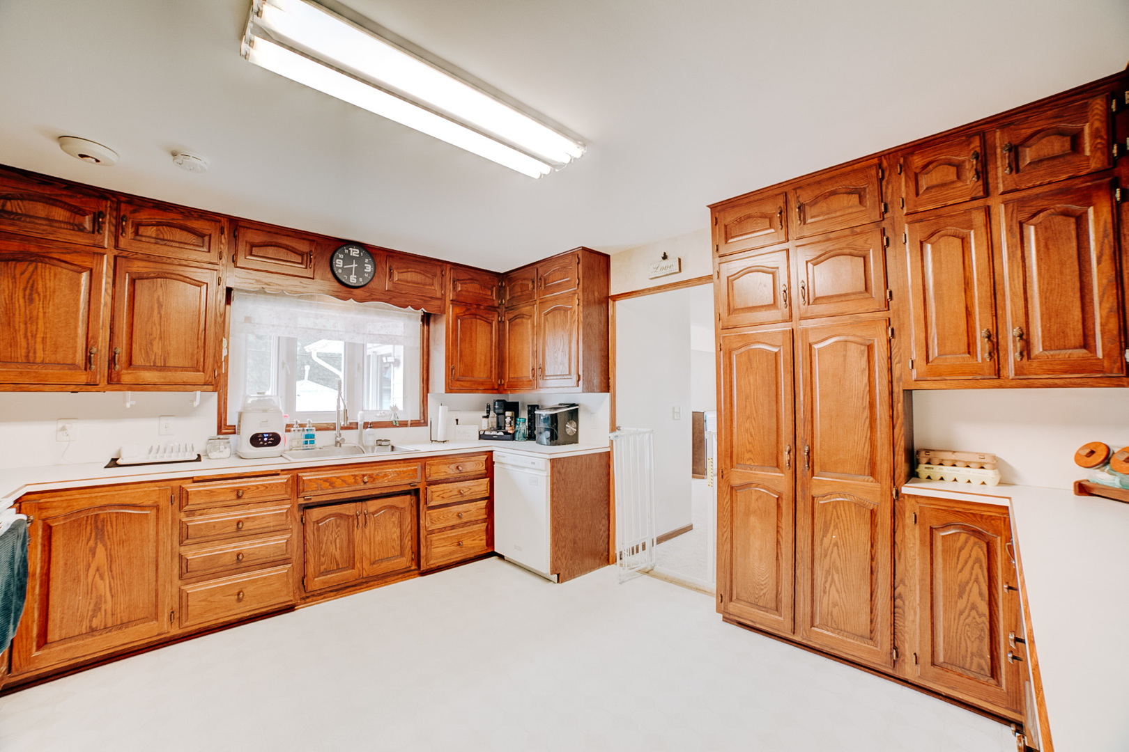 905 South 4th Street Watseka, IL 60970 - Photo 7 of 29 a large kitchen with stainless steel appliances granite countertop a sink and cabinets