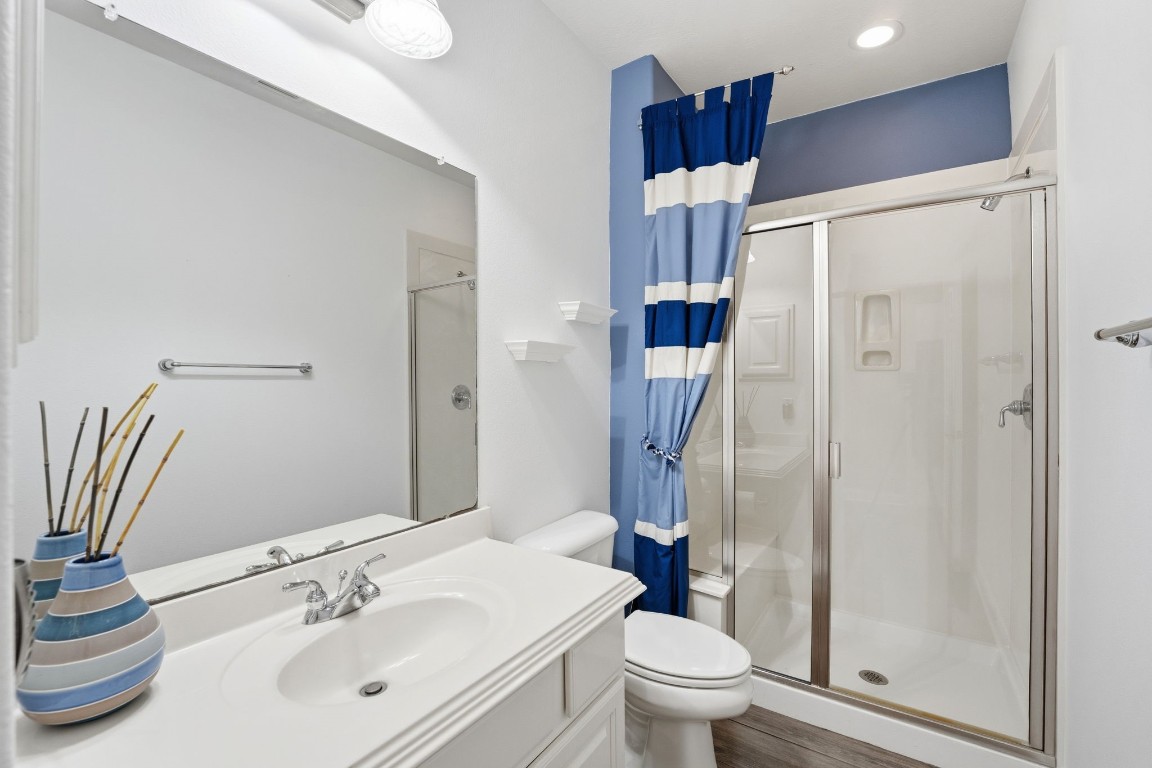 99 Bagpipe Way Conroe, TX 77384 - Photo 20 of 40 a bathroom with a sink toilet and shower