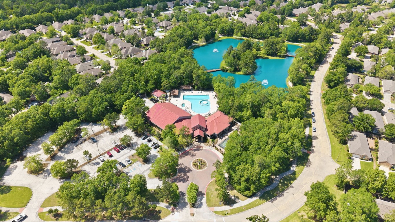 99 Bagpipe Way Conroe, TX 77384 - Photo 36 of 40 an aerial view of a house with a yard and garden