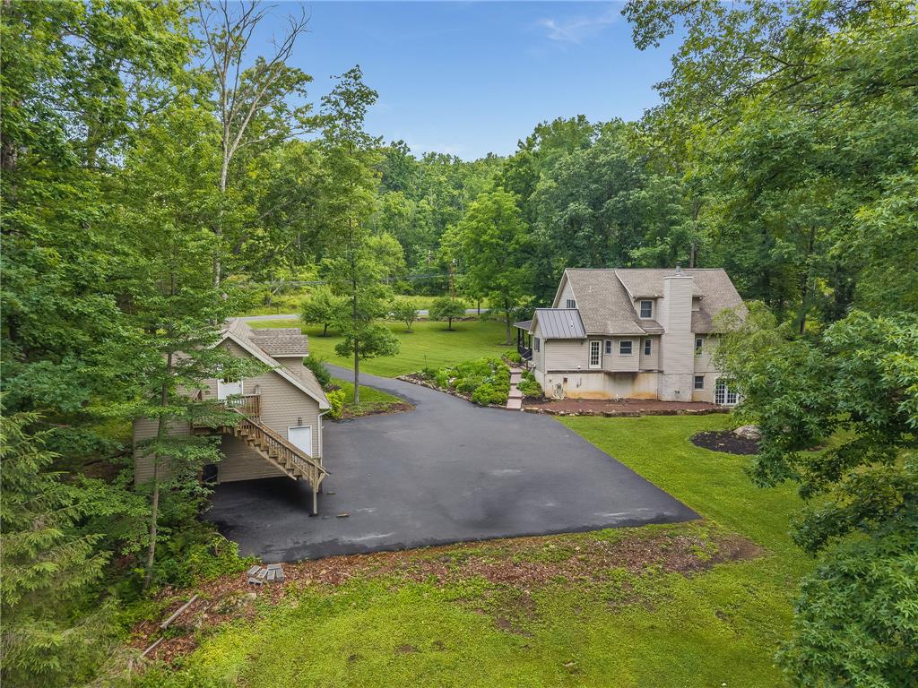 465 Raubsville Road Easton, PA 18042 - Photo 8 of 60 A private estate with a spacious driveway, encircled by natural woodlands.